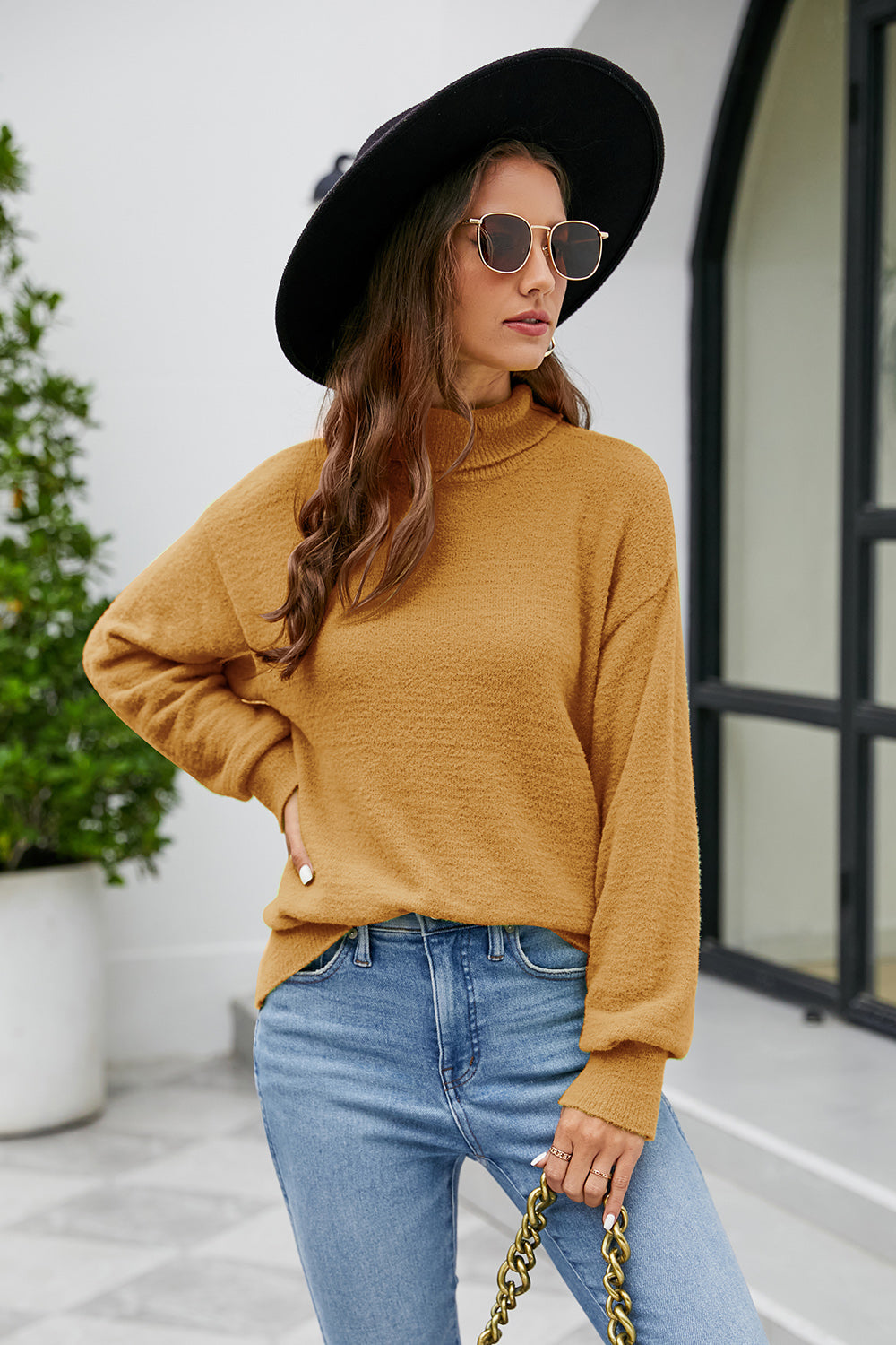 Textured turtleneck sweater in tan with relaxed fit and long sleeves.