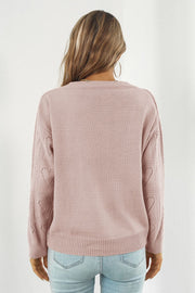 Dusty Pink acrylic V-neck knit pullover sweater with heart stitch detail on sleeves.