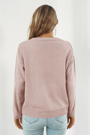 Dusty Pink acrylic V-neck knit pullover sweater with heart stitch detail on sleeves.