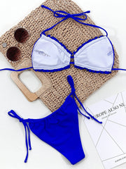 Royal blue bikini set with ruffled trim and tie sides.