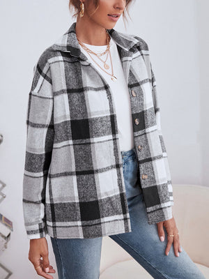 Oversized plaid shacket with button closure in black, white, and grey.