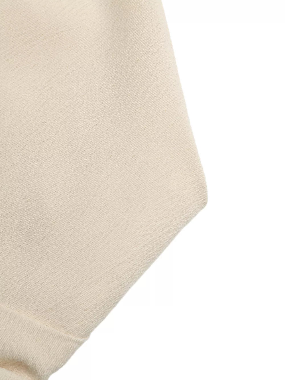 Cream pleated V-neck strapless romper fabric detail