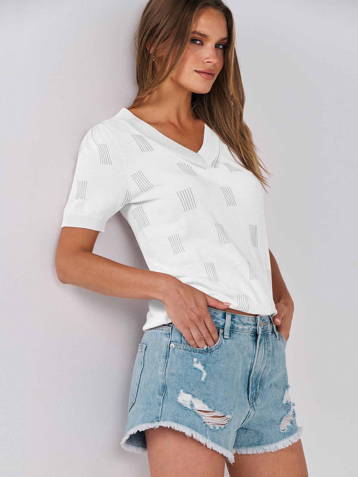 White textured stripe knit V-neck sweater top with short sleeves.