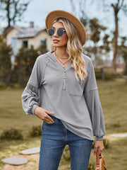 Gray ribbed henley hoodie with balloon sleeves and buttoned placket.