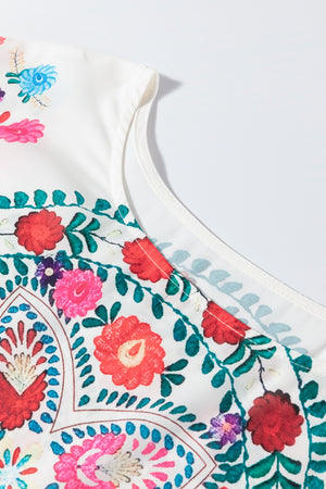 Embroidered medallion peplum blouse in floral print with ruffled neckline detail
