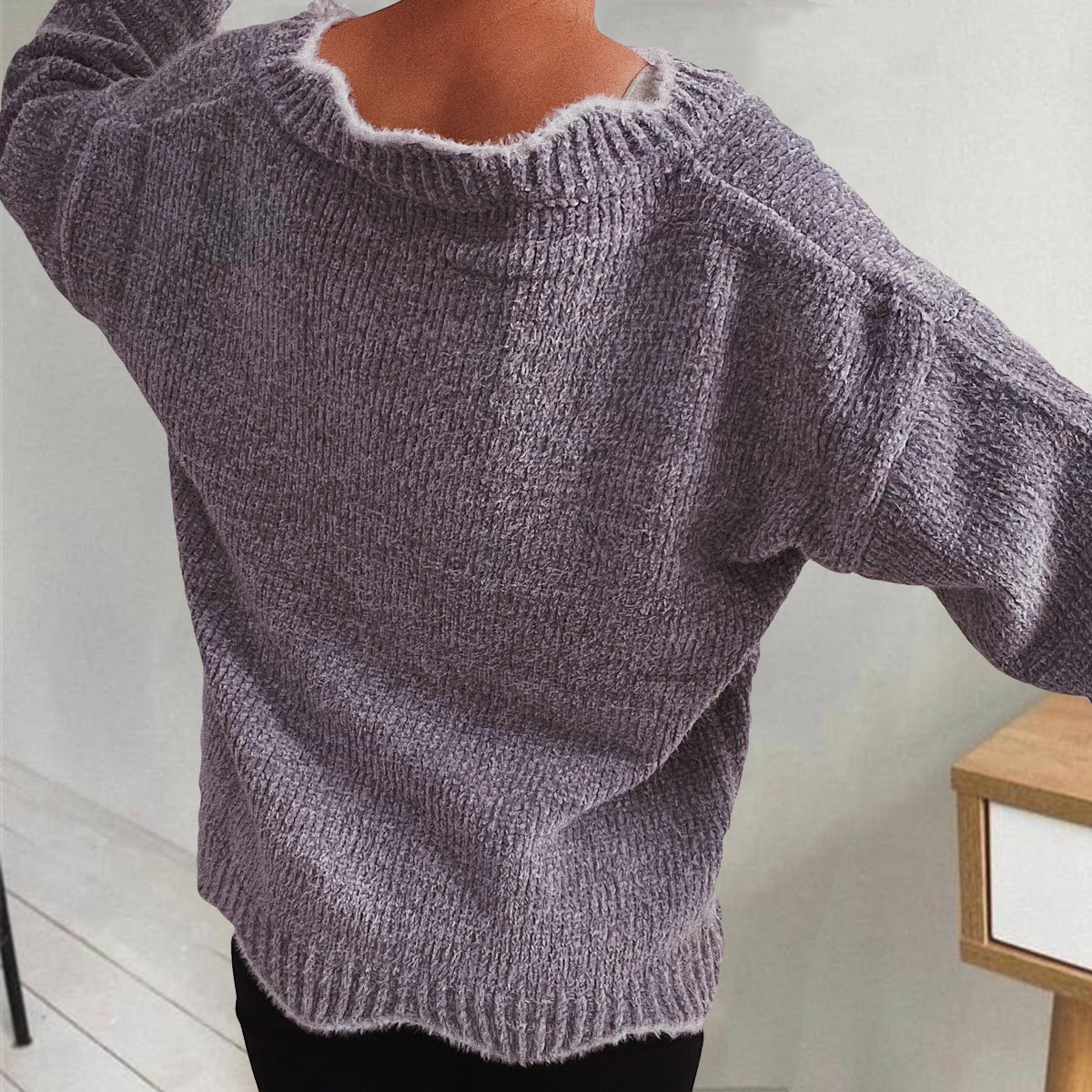Lavender knit sweater with scalloped trim and ribbed texture.