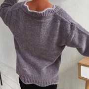Lavender knit sweater with scalloped trim and ribbed texture.