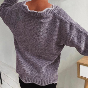 Lavender knit sweater with scalloped trim and ribbed texture.