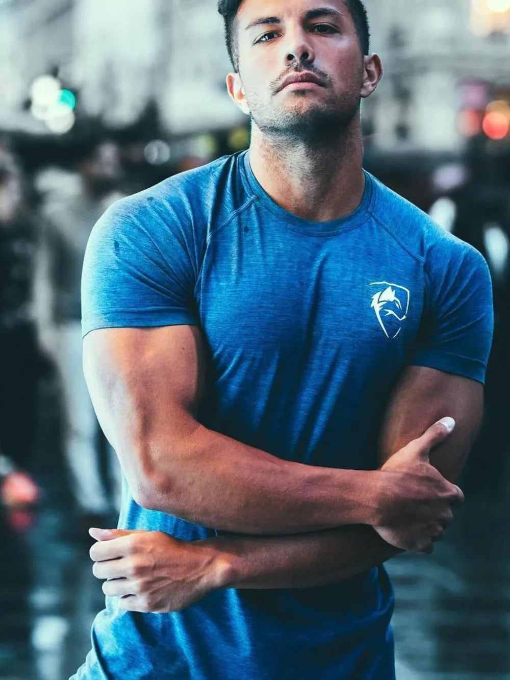 Blue performance raglan tee with emblem on chest
