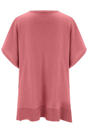 Relaxed V-neck knit poncho top in Dusty Pink with short sleeves and ribbed hem.