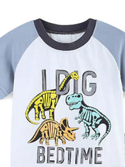 Toddler cotton crew neck sleep shirt with dinosaur skeleton graphic and "BIG BEDTIME" text.