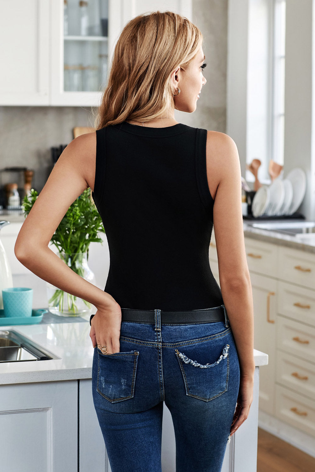 Black ribbed knit scoop neck tank top with a casual fit.