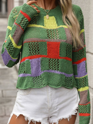 Green openwork knit sweater with colorful patchwork blocks and stripes, long sleeves, crew neck.