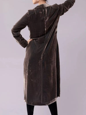 Longline velvet trench coat in dark taupe, featuring a draped cut and buttoned front.
