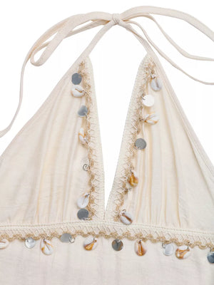Bohemian halter maxi dress in apricot with shell and sequin trim.