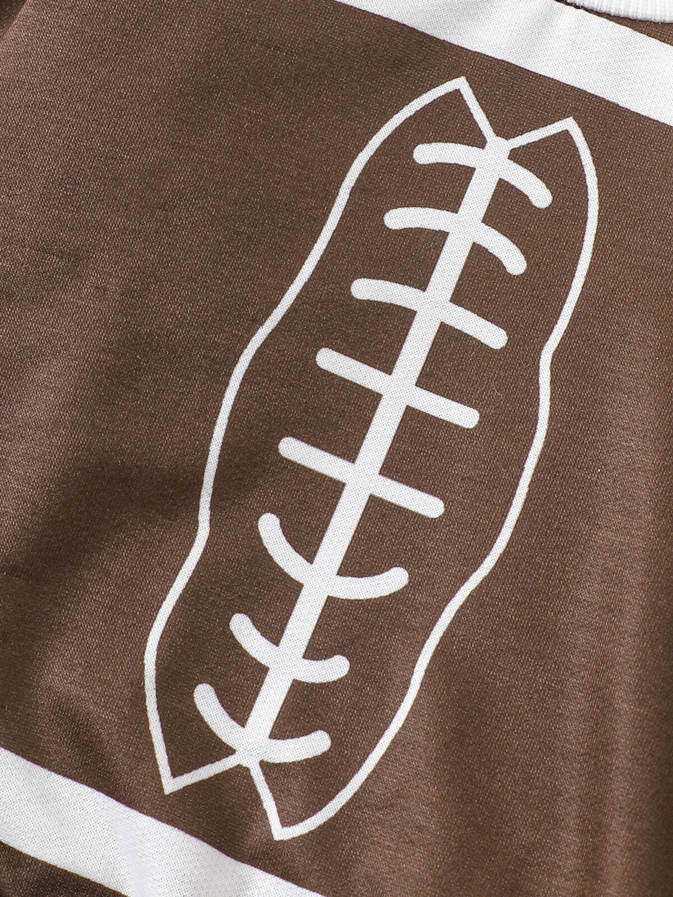 Brown baby top with white football print and stripes