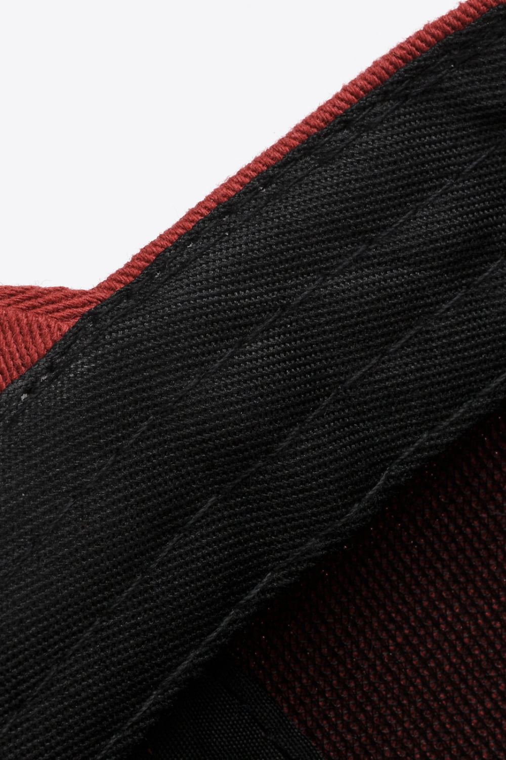 Deep Red baseball cap detail showing black adjustable strap and stitching.