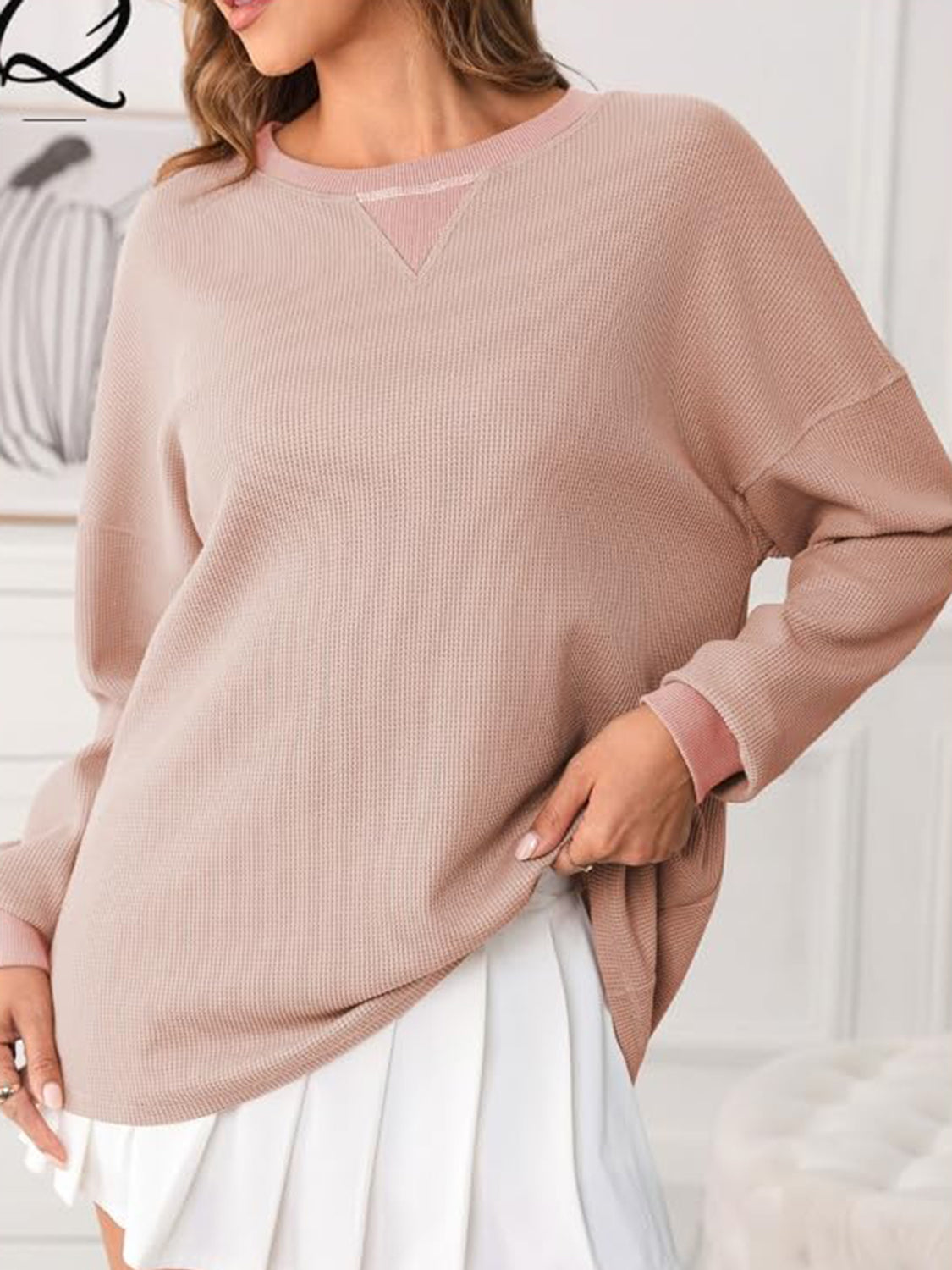 Pale Blush waffle knit raglan sleeve sweatshirt with V-neck detail and ribbed cuffs.