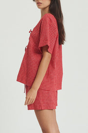 Deep red plaid cotton open-front top and shorts set with tie detail