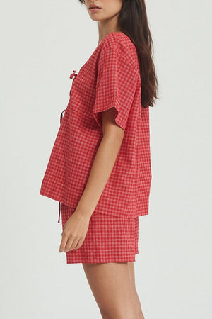 Deep red plaid cotton open-front top and shorts set with tie detail