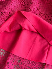Fuchsia pink lace A-line dress with cutout detail and lining.