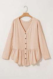 Dust Storm peplum button-down v-neck top in cotton with a ruffled hem.