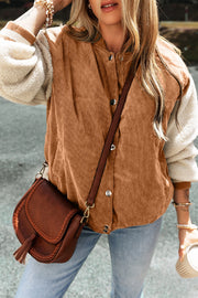 Corduroy bomber jacket in Terracotta with sherpa sleeves and contrast striped cuffs.