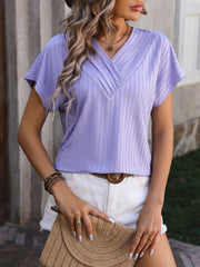 Lavender textured surplice v-neck tee with short sleeves.