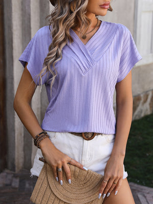 Lavender textured surplice v-neck tee with short sleeves.