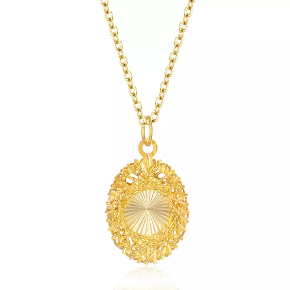 Gold openwork pendant necklace with delicate chain and oval cage design.