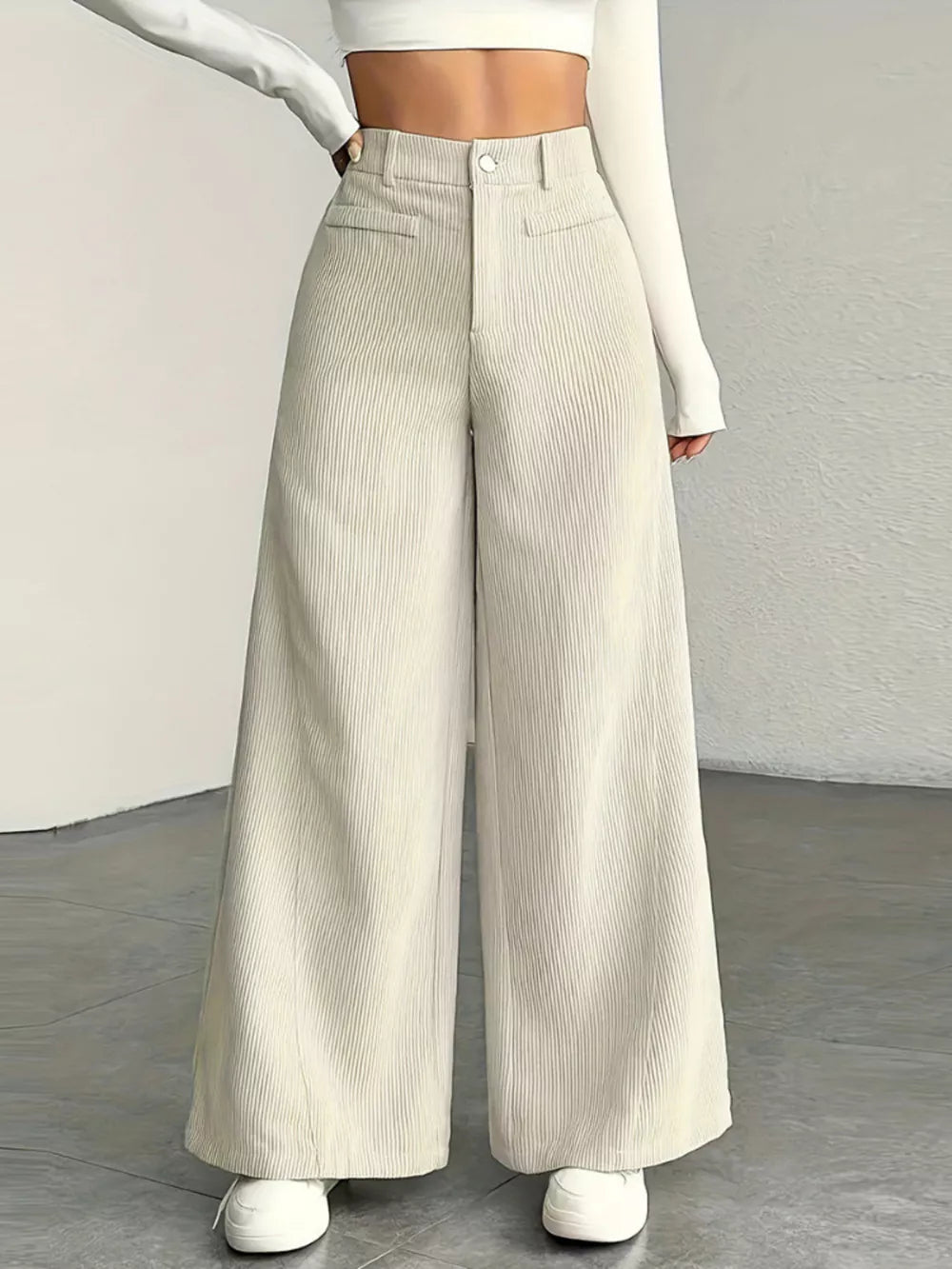 Apricot corduroy wide-leg maternity trousers with a high waist and pockets.
