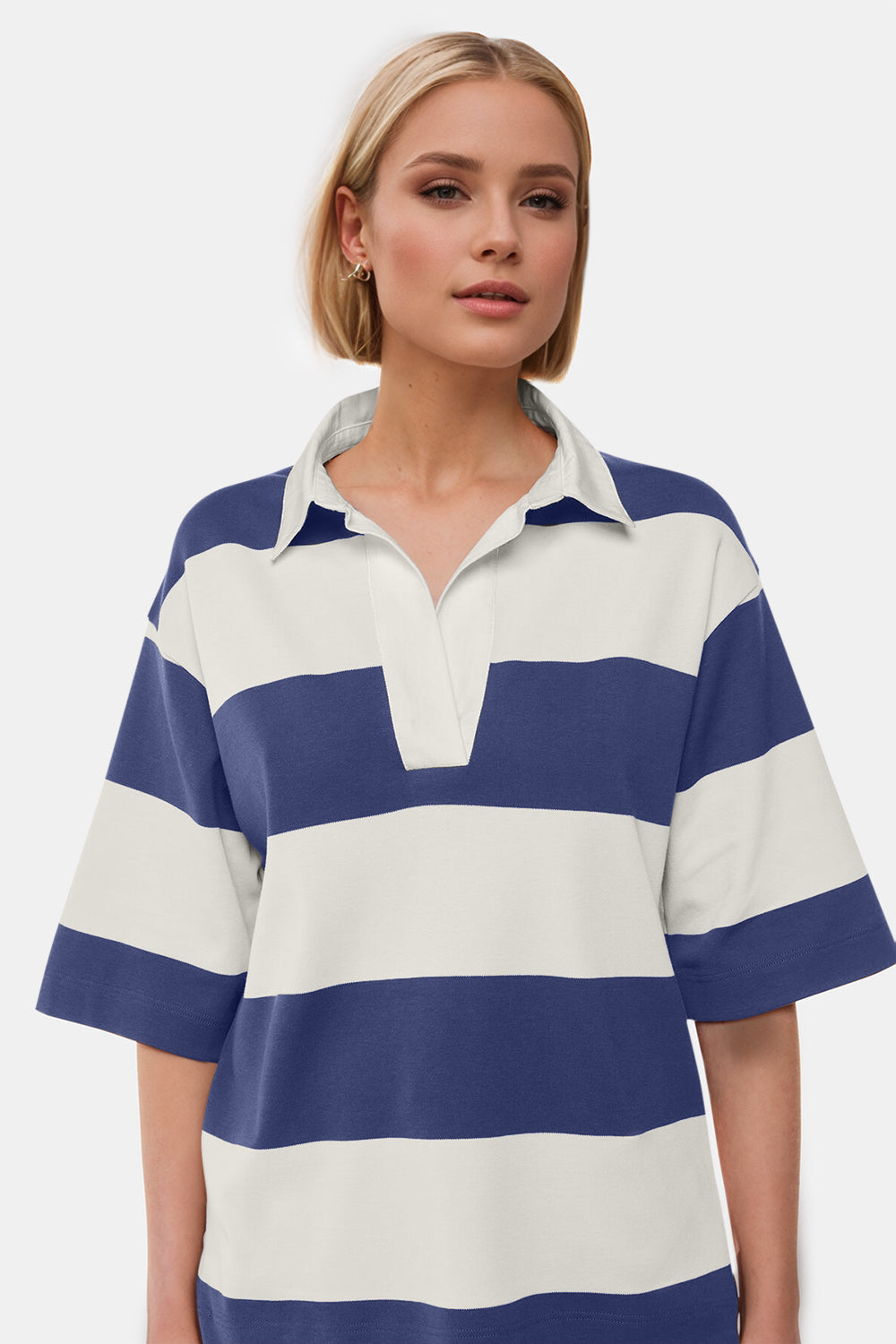 Oversized polo shirt with rugby stripes in blue and cream, featuring a classic collar and short sleeves.