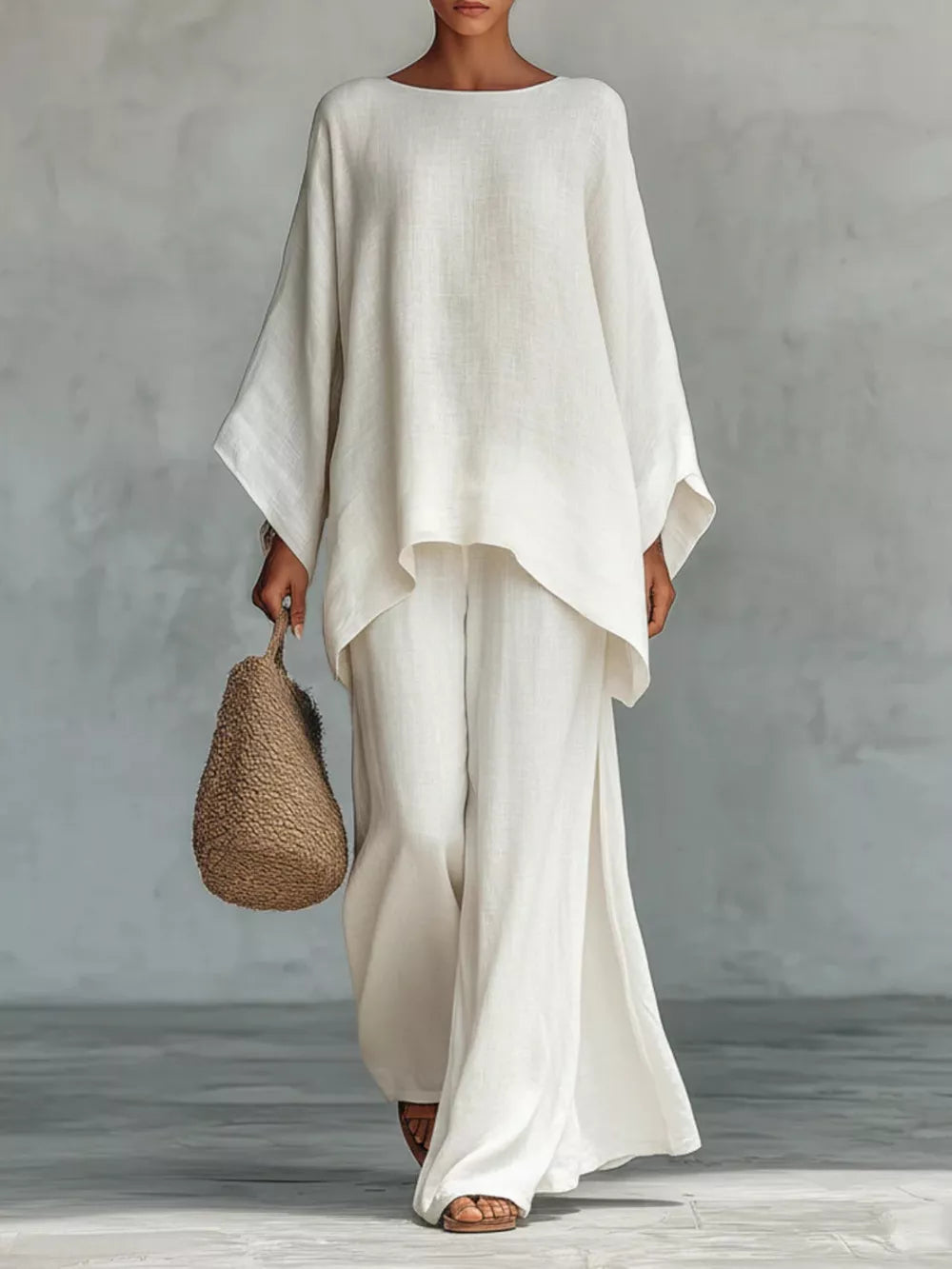 White polyester two-piece set with flowing top and wide-leg pants