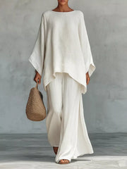 White polyester two-piece set with flowing top and wide-leg pants