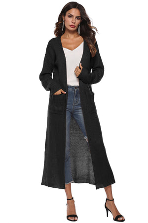 Longline black knit cardigan with side slits and pockets.