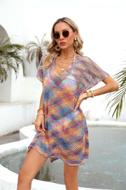 Open-knit caftan cover-up with multicolor stripes and a slit hem.