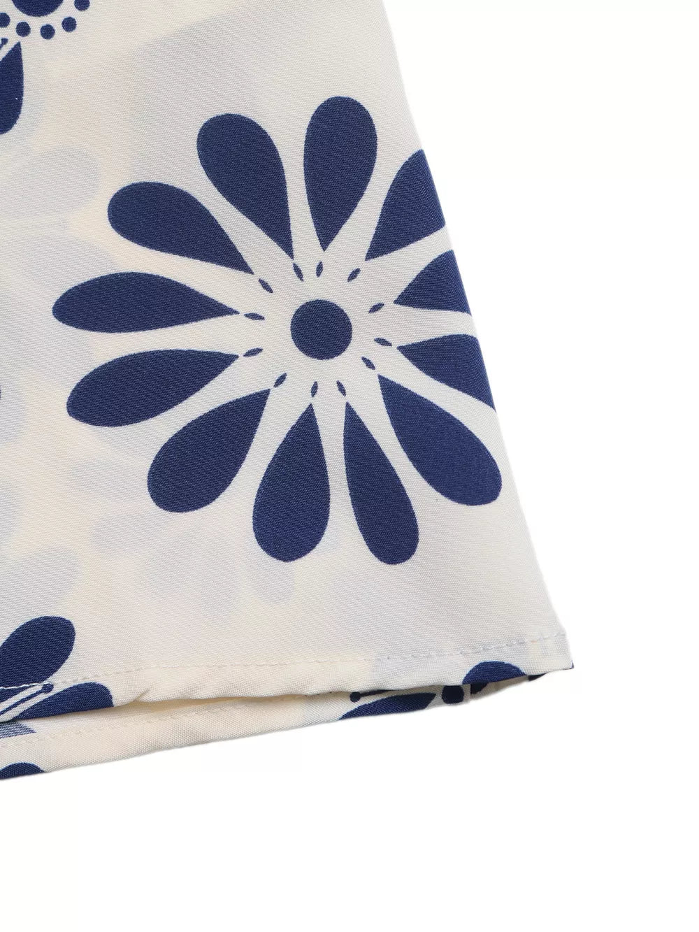 Maxi dress with navy blue floral print on white fabric, featuring cutout waist detail.