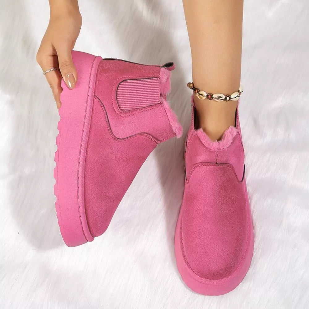 Hot Pink suede round toe platform ankle boots with faux fur lining.
