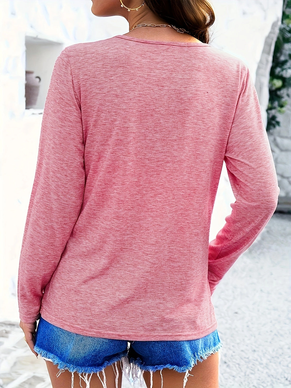 Long sleeve heathered tee in pink with round neckline.