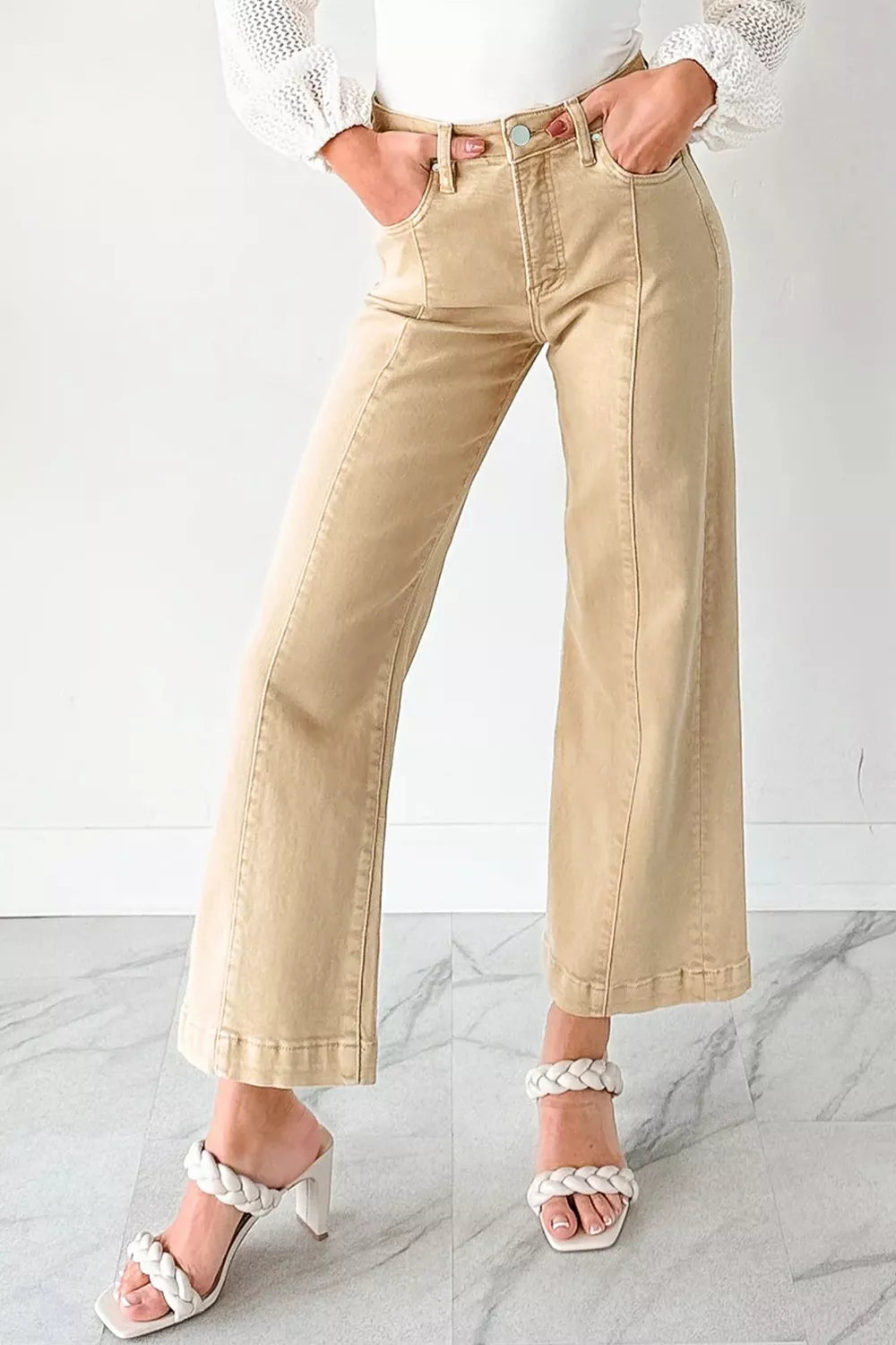 High-waisted cropped wide-leg jeans in tan denim with front seam detail.