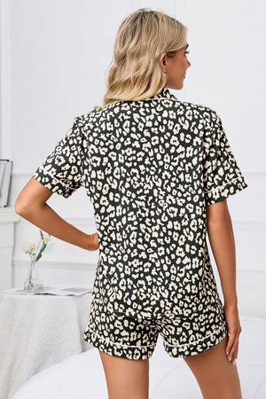 Pajama set with black and cream leopard print, short sleeves, and contrast piping.