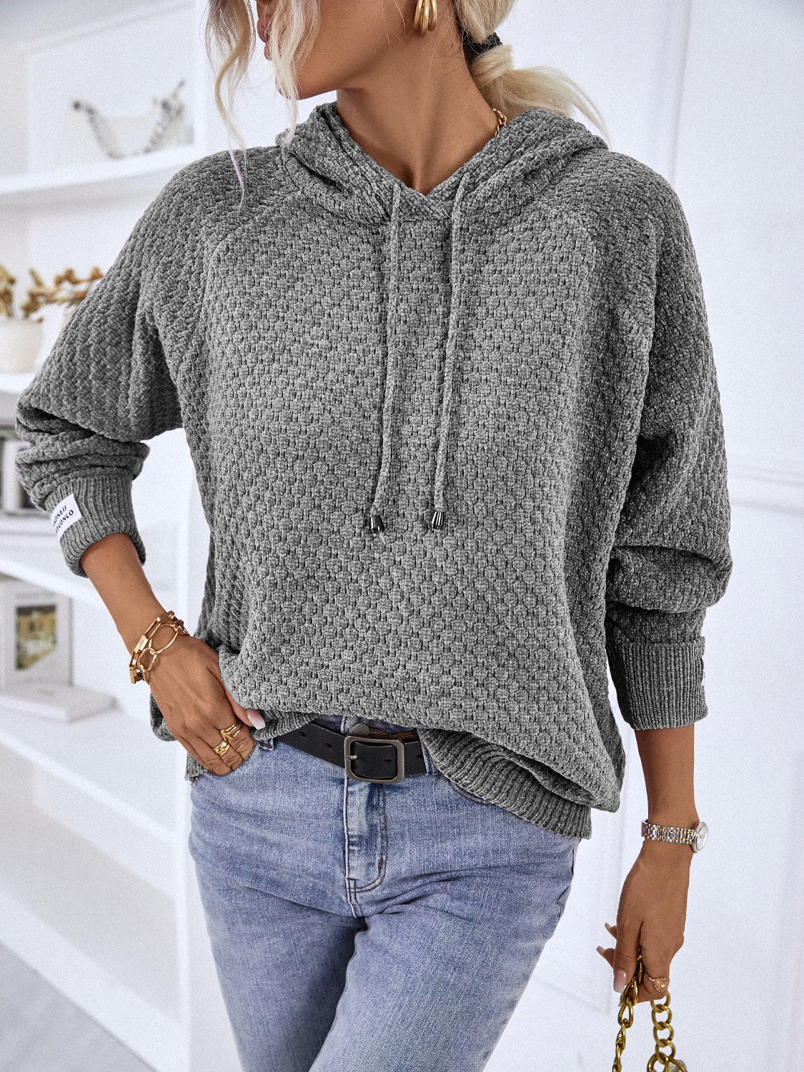 Charcoal textured knit raglan sleeve hoodie with drawstring hood and cuffed sleeves.