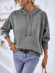 Charcoal textured knit raglan sleeve hoodie with drawstring hood and cuffed sleeves.