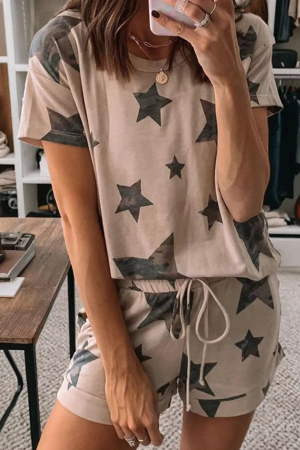 Camo star print pajama set with drawstring shorts and short sleeve top.