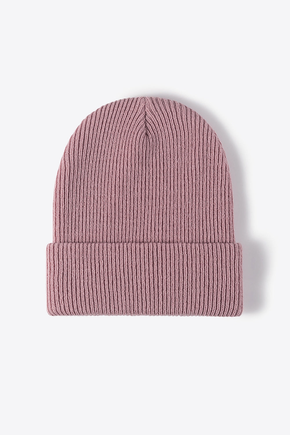 Pink ribbed knit beanie with a cuffed brim.