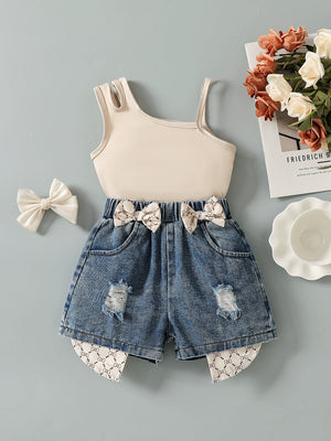 Baby asymmetrical tank top and distressed denim shorts set with bow accents.