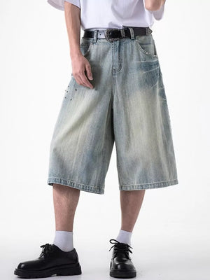 Relaxed fit light blue denim shorts with coin pocket and studded details.