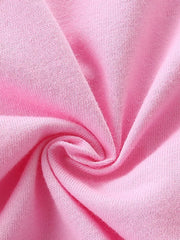 Pink cotton toddler pajama top with ruffled detail