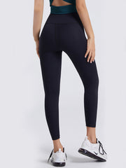 Black high-waist leggings with contouring seams.
