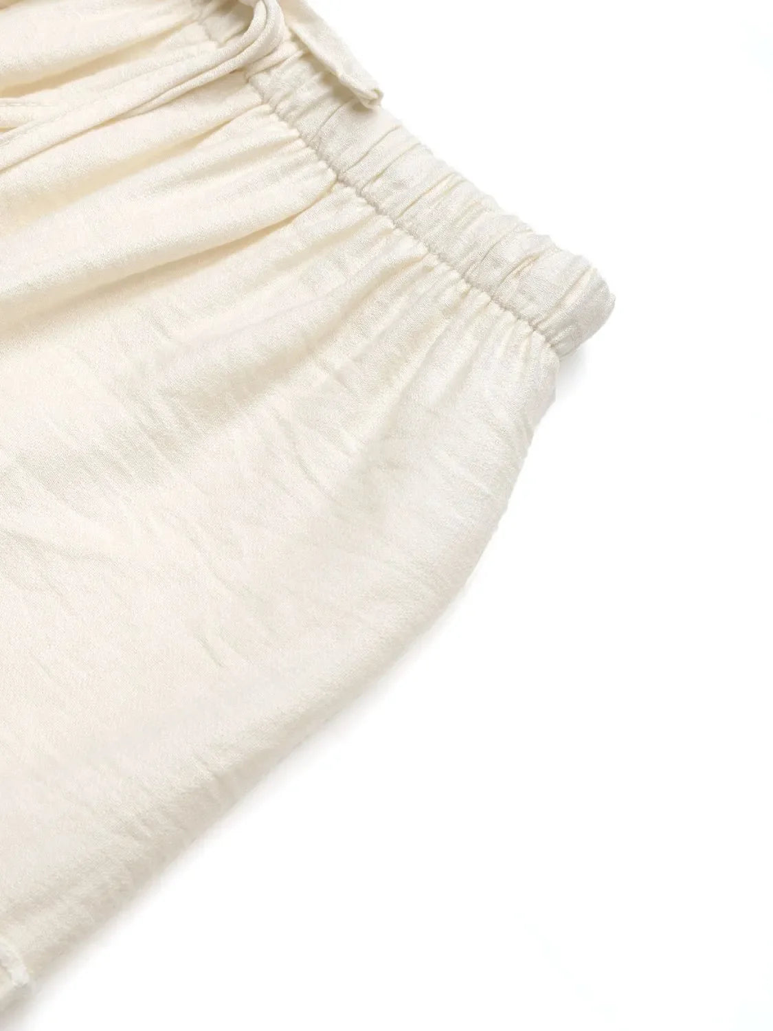 Cream textured tiered midi skirt with elastic waistband and drawstring detail.